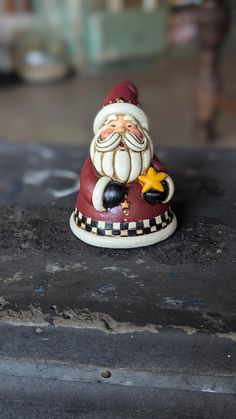 I believe this is a resin figurine featuring jolly old St. Nick. The black bottom is slightly rounded. There aren't any chips in the paint and it's just small enough to enjoy among your collection of holiday decor.  Santa sits at about 4.5 inches tall and 3 inches wide. Figurine, Texture Ideas, Resin Figurine, Santa Figurines, Black Bottom, St Nick, Santa Claus Christmas, Christmas Figurines, Hair Texture