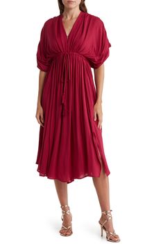 Slip into style with this puffed sleeve midi dress that exudes effortless attitude. 45" length (size S) V-neck Short puff sleeves Tied waistline 100% rayon Hand wash Imported Model stats: 5'10" height, 32" bust, 25" waist, 36" hip. Model is wearing size S. Fall Rayon Midi Dress With Short Sleeves, Fall Midi Dress With Short Sleeves In Rayon, Billowy Midi Dress With Puff Sleeves For Daywear, Knee-length Midi Dress With Elastic Sleeves For Brunch, Chic Billowy Midi Dress For Daywear, Midi Dress With Elastic Sleeves For Spring, Flowy Midi Dress With Elastic Sleeves, Solid Midi Dress With Elastic Sleeves For Spring, Summer Midi Dress With Blouson Sleeves