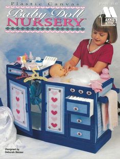 Baby Doll Nursery ~ Plastic Canvas ITEM DESCRIPTION DETAILS: BRAND/PUBLISHER: Annie's Attic PUBLICATION YEAR: 1996 PAGES: 18 CRAFT TYPE: Plastic Canvas ITEM CONDITION: New Patterns include: Children love to try out their parenting skills at an early age!  Practice makes perfect and there is plenty to inspire the imagination with this nursery set. Craft patterns use 7-count plastic canvas. Clothes Hangers ~ 5¾" x 3½" White Yellow Rose Crib ~ 6¾" high x 14¾" long x 11¾" wide Cabinet ~ 19" high x 2 Doll Furniture Patterns, Soft Toy Storage, Doll Nursery, Baby Doll Nursery, Plastic Canvas Pattern, Vintage Cross Stitch Pattern, Plastic Canvas Patterns Free, Clothes Hangers, Nursery Set