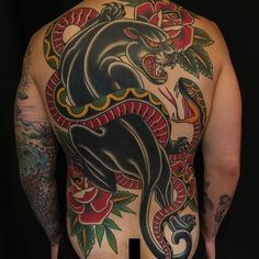 the back of a man with tattoos on his body