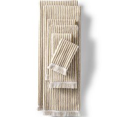 three striped towels with fringes on them