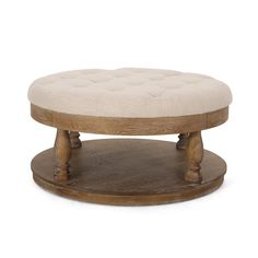 a wooden foot stool with a white cushion