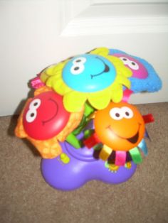 a bunch of toys that are sitting on the floor in front of a door,