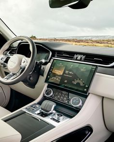 the interior of a modern car with dashboard and steering wheel