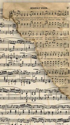 an old sheet with music notes on it and the words heavenly vision written in cursive writing