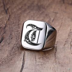 This Custom Old English Initial Signet Ring is a timeless piece of jewelry designed to add personalisation to any look. The classic Old English font brings a classic yet modern touch to any occasion. Customize this ring with your initial letter of choice for a unique, one-of-a-kind look.   SPECIFICATIONS   Surface Width: 18MM  Style: Vintage  Shapepattern: Letter  Metals Type: Stainless Steel  Material: High quality Stainless Steel  Material: Metal  Item Type: Rings  Environmental Standard: Lead Signet Ring For Men, Hip Hop Bling, Mens Stainless Steel Rings, Letter Ring, Wolfram, Initial Ring, Ring For Men, Stainless Steel Rings, Steel Ring