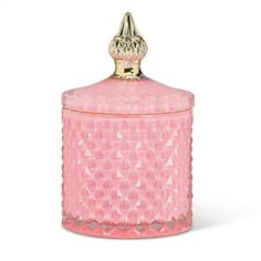 a pink glass jar with a gold lid