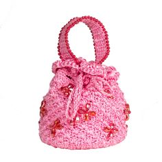 a pink crocheted purse with a bow on the front and side, sitting against a white background