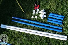 several blue and white objects laying on the grass