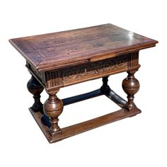 an old wooden table with two legs and a drawer on the top, against a white background