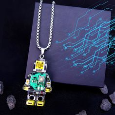 Unleash your inner tech enthusiast with our one-of-a-kind Robot Pendant Necklace. This wearable work of art seamlessly blends geeky charm with elegant design. 🤖 This pendant showcases a meticulously detailed robot silhouette. Its circuit board-inspired pattern adds an intriguing twist. Whether you're a tech aficionado or simply appreciate distinctive jewelry, this necklace suits all genders and styles. Wear it proudly to express your love for all things tech. Size: ~40mm height Robot Silhouette, Tech Enthusiast, Geeky Jewellery, Tech Jewelry, Tech Fashion, Necklace Unique, Unisex Accessories, Circuit Board, Star Fashion