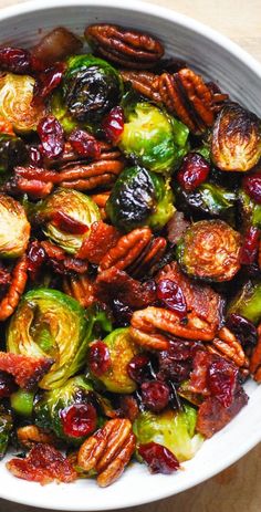 brussel sprouts with pecans and cranberries in a white bowl