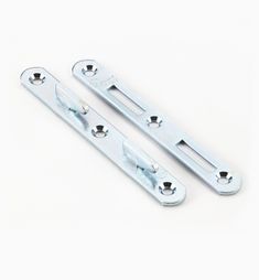 two metal door handles on a white background