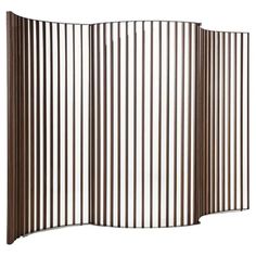 a room divider that is made out of metal bars and has brown stripes on it