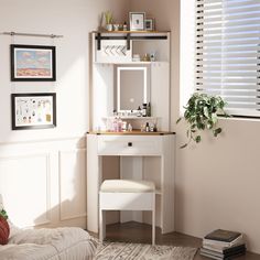 a bedroom with a white vanity and mirror