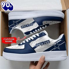 a pair of sneakers with the word cowboys on them in a box, and an image of