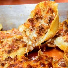 some food is sitting in a pan on the table and ready to be eaten by someone