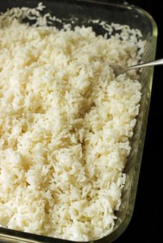 rice is being cooked in a glass dish