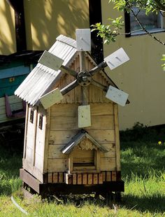 a small house made out of wood and metal