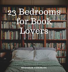 a bed sitting in front of a book shelf filled with books and pillows on top of it