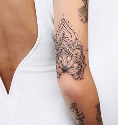 a woman with a tattoo on her arm