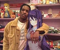 a man and woman standing next to each other in front of shelves with dolls on them