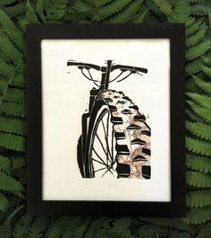 a black and white drawing of a bike on the side of a fern covered wall