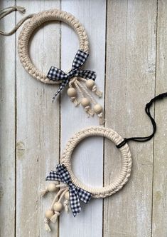 two wreaths made out of rope and wooden beads