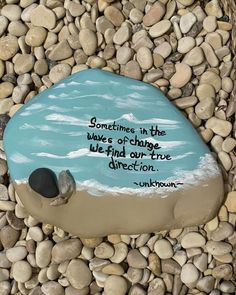 there is a rock with a quote on it