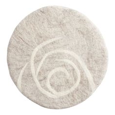 a white circular rug on a white background