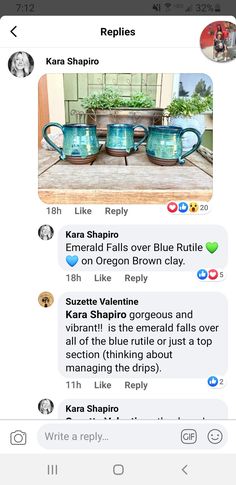 two blue teapots sitting next to each other on top of a wooden table