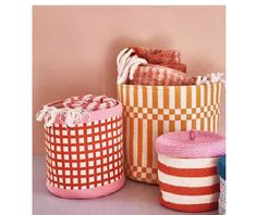 several baskets are lined up on a shelf