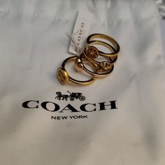 Nwt Coach Gold Plated 4 Set Of Rings In Size 7 With Dust Bag Everyday Gold Coach Jewelry, Coach Ring, Set Of Rings, Coach Jewelry, 7 Rings, Jewelry Ring, Womens Jewelry Rings, Ring Set, Ring Sets