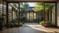 an open door leading to a courtyard with trees and plants in the foreground, surrounded by glass walls