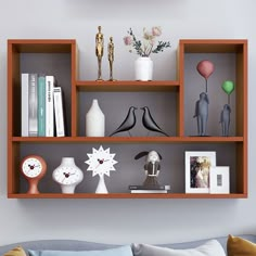 a living room filled with lots of furniture and decor on top of bookshelves