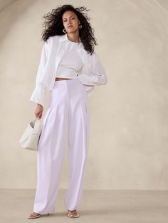 We opted for double pleats at the front for this high-waisted pant—the better to emphasize the beautiful drape of this silky twill fabric.  Here, the silhouette is relaxed, giving this pair an air of at-ease elegance that will carry you through all seasons.  High rise (12. 5"), relaxed fit with a wide leg.  Sustainability: Made with LENZING™ ECOVERO™, a breathable fiber derived from certified renewable wood sources, produced using methods that reduce water impact and emissions by up to 50% compared to traditional viscose.  Zip fly with hook-and-bar closure.  Front and back pockets.  Unlined.  High rise (12. 5"), relaxed fit with a wide leg.  Full length.  Inseams: Petite/Short 28", Regular 30", Tall 33" Model: Size 2, 5'10" (178cm). Pleated Pant, Petite Shorts, Twill Pants, Classy Chic, Pleated Pants, Twill Fabric, Bottom Clothes, Bottoms Pants, Fashion Classy