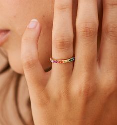 Meet our Rainbow Band Ring- this whimsical piece is adorned with an arc of meticulously selected CZ stones, each shimmering with the joyous hues of the rainbow. Perfect for the color-loving daydreamer, this ring is more than an accessory—it's your very own piece of wearable joy. Rainbow Band, Rainbow Ring, Rainbow Rings, Zodiac Necklaces, Gold Piece, Flower Bracelet, Color Ring, Everyday Jewelry, Huggies Earrings