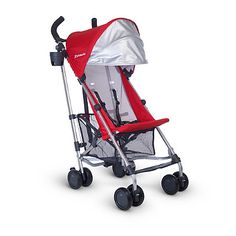 the stroller is red and silver with black wheels