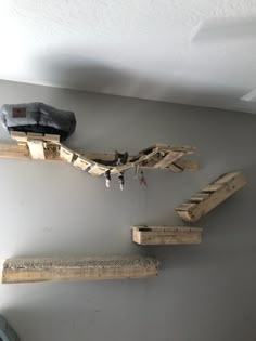 three pieces of wood are hanging on the wall