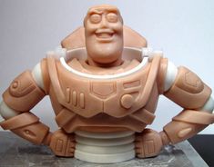 a close up of a toy figure on a table