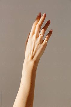 a woman's hand reaching up into the air