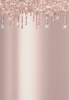 a pink background with lots of white and silver sparkles on it's edges