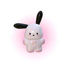 a white and black rabbit toy on a pink background