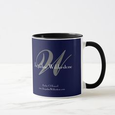 a black and white coffee mug with the letter w on it's front side