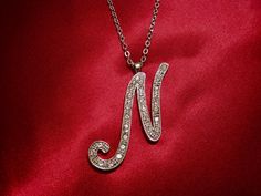 Beautiful Silver Plated Big Letter "N" Pendant Ornate with Sparkling Rhinestones. Silver Tone Link Chain Necklace with Lobster Claw Clasp. The Pendant is Signed inside the Pendant Loop/Bail. In very good vintage condition. N Necklace, Initial N, Big Letter, Big Letters, Letter N, Link Chain Necklace, Pendant Silver, Chain Link Necklace, Link Chain