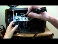 someone is working on an old fashioned radio