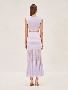 Introducing The Alexis Set: Emille Top and Franki Skirt, the perfect combination of elegance and effortlessness. This lilac piece effortlessly blends a fitted form and airy pleats, resulting in a mesmerizing silhouette that flows with your every step. The perfect for seamlessly transitioning from day to night.