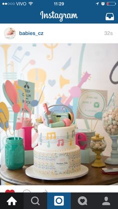 a table topped with a cake covered in lots of candies and other things on top of it