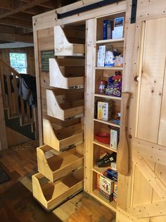 the shelves are made out of plywood and have been built in order to hold items