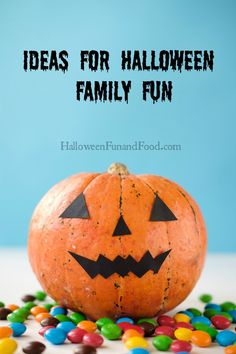 an orange pumpkin with the words ideas for halloween family fun on it surrounded by candy